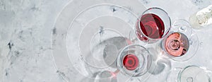 Wine tasting concept - glass with different wine on marble background