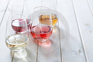 WIne tasting concept - red, rose and white wine in glasses