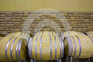 Wine tuns against stone wall