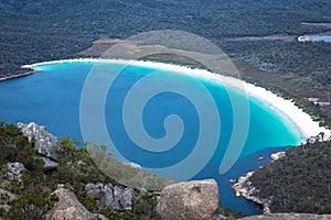 Overview of Wineglass Bay in Freycinet National Park From Mount Amos Lookout, East Tasmania, Australia photo