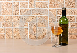 Wineglass on brick background