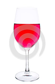 Wineglass with diluted wine photo