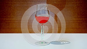 Wineglass fills with changing color and flashing liquid