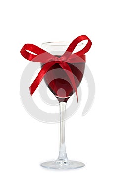 Wineglass with wine and ribbon