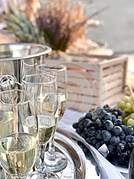 Wineglasses with champagne decor and grapes