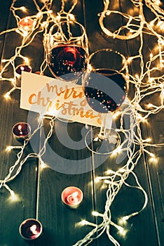 Wineglasses and merry christmas card