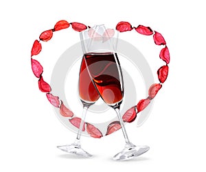 Wineglasses with red wine inside a heart shape