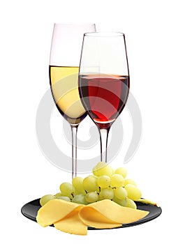 Wineglasses with white and red wine and cheese