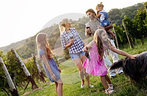 Winemaker family together in vineyard