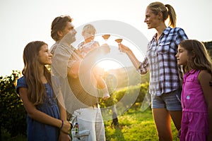 Winemaker family together in vineyard