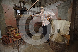 Winemaker at the grapes press