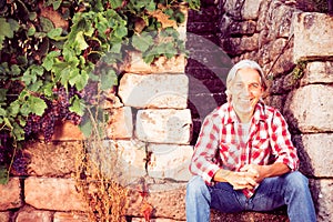 Winemaker Sitting On Stone Steps