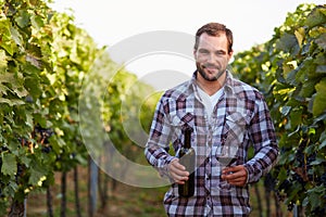 Winemaker in vineyard