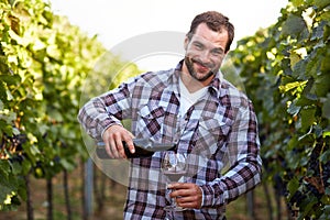 Winemaker in vineyard