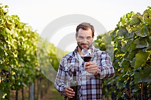 Winemaker in vineyard