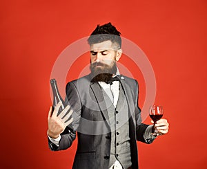 Winetasting and degustation concept. Man holding glass of cabernet photo