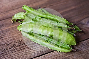 Wing bean wooden table background, young winged beans vegetable