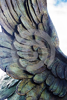 Wing detail of statue commemorating peace.