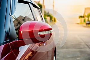 Wing mirror on red car with turn signal