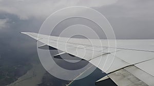 Wing of the plane and clouds, view from the plane. Version 4