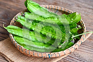 Winged Bean on basket and sack background, Psophocarpus tetragonolobus - Green winged or Four angle beans