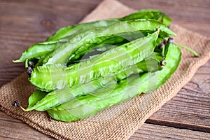 Winged Bean on sack background, Psophocarpus tetragonolobus - Green winged or Four angle beans