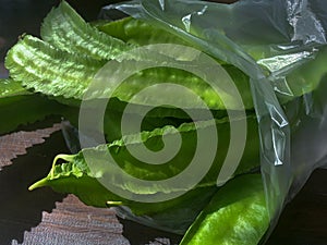 Winged beans or four-angled beans on wooden table