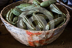 Winged beans in the wicker basket in the Indian market in Mauritius