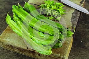 Winged beans on wooden background