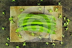 Winged beans on wooden background