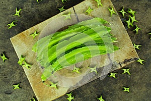 Winged beans on wooden background