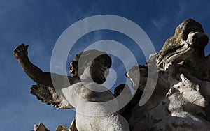 Winged boy riding the lion