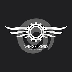 Winged gear white icon on black background