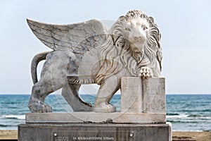 Winged Lion of Venice statue at Foinikoudes promenade. Smiling lion monument, Larnaca. Cyprus