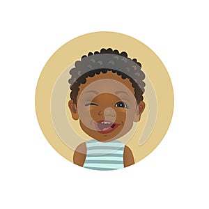 Winking Afro American child. Playful African toddler emoticon. Cute dark-skinned baby facial expression.