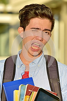 Winking Youthful Diverse Boy Student With Notebooks