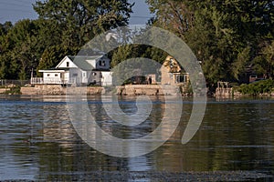 Winnebago Lake Reflections: Serene Skyline and Lakeside Houses photo