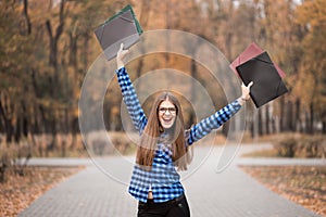 Winner girl euphoric wearing in blue shirt, feeling great things on career way, working toward success and reached it