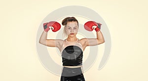 she is a winner. knockout. fit your body. punching. teen girl training in boxing gloves.