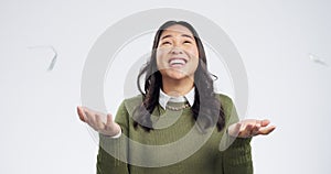 Winner, money and excited Asian woman on a white background with success, lottery and victory. Studio, surprise and