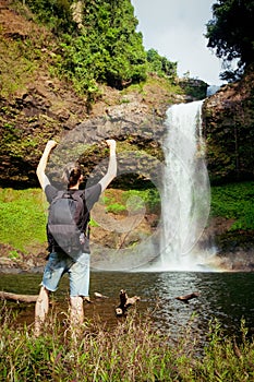 Winner near waterfall. Active life concept