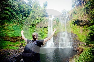 Winner near waterfall. Active life concept