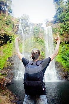 Winner near waterfall. Active life concept