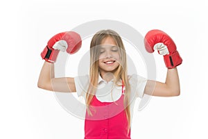 Winner takes it all Child ambitious likes win and success. Girl on smiling face posing with boxing gloves as winner