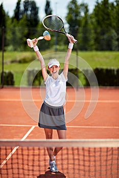 Winner in tennis match on tennis court