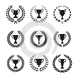 Winner Trophy Cup Silhouette Set with circular laurel foliate an photo