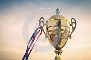 Winner trophy on sky background