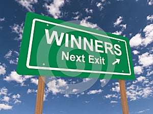 Winners next exit road sign