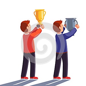 Winners raising gold and silver champion trophy up