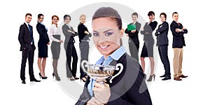 Winning businessteam, female holding trophy